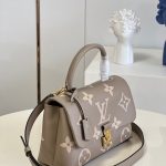 louis-vuitton-madeleine-mm-bicolor-monogram-empreinte-leather-handbags-M46041_PM2_Front-view.png