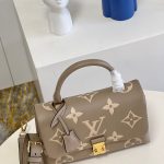 louis-vuitton-madeleine-mm-bicolor-monogram-empreinte-leather-handbags-M46041_PM2_Front-view.png